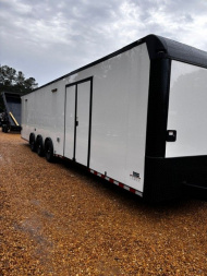 New 2025 8.5X34' BATHROOM RACE TRAILER -BLACKOUT TRIM-ESCAPE DOOR-TRIPLE AXLE-7' INTERIOR HEIGHT-CABINETS Car / Racing Trailer