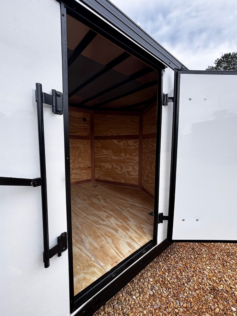 New 2025 8.5X20 ENCLOSED CAR HAULER-16" CENTERS-1 PIECE ROOF-.080 POLYCORE EXTERIOR-BLACKOUT PACKAGE