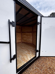 New 2025 8.5X20 ENCLOSED CAR HAULER-16" CENTERS-1 PIECE ROOF-.080 POLYCORE EXTERIOR-BLACKOUT PACKAGE