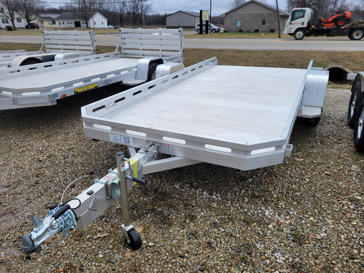 New 2026 Aluma 7814 Tilt Single Axle Slotted Rail Utility Trailer