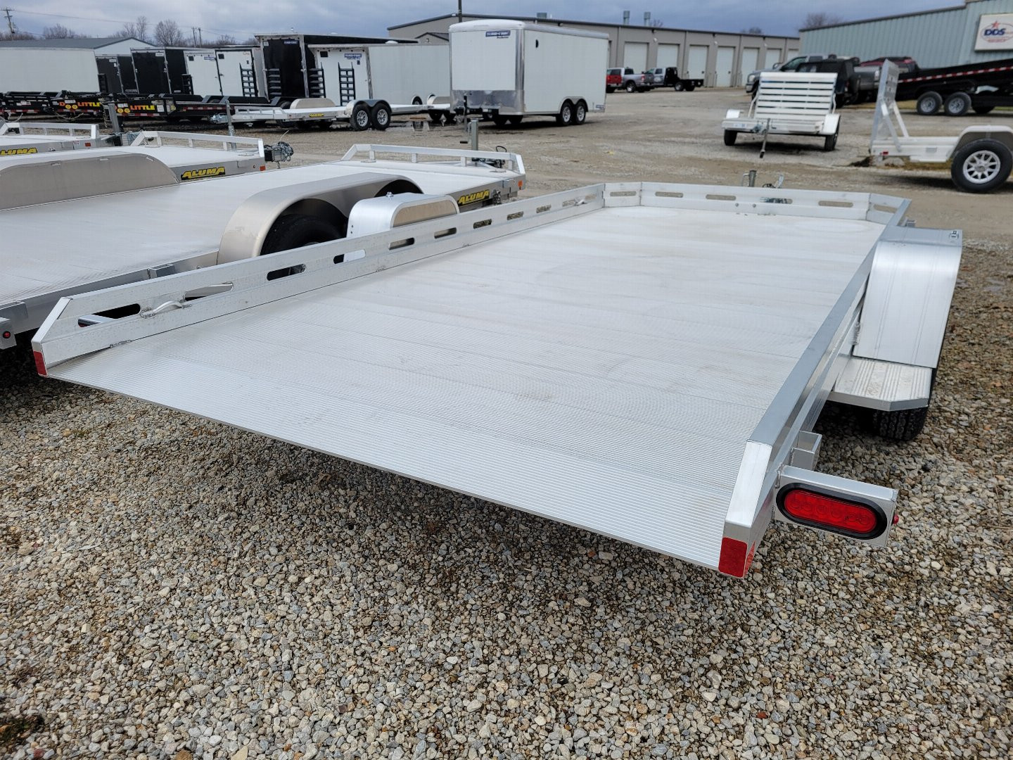 New 2026 Aluma 7814 Tilt Single Axle Slotted Rail Utility Trailer