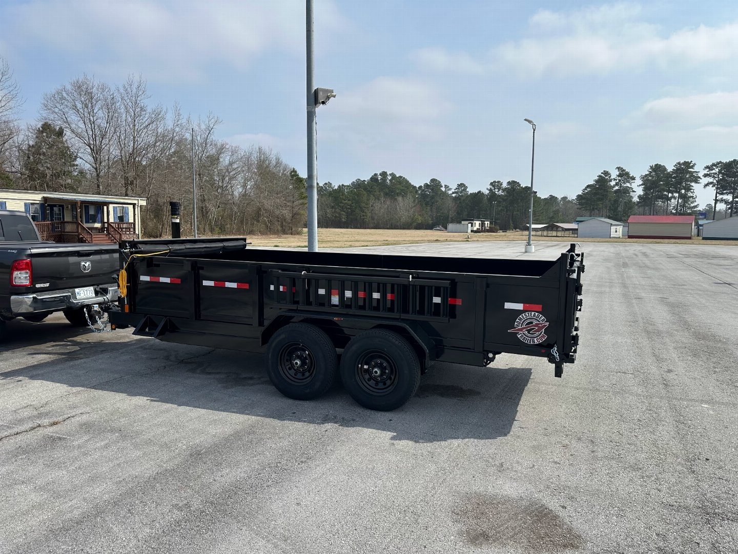 New 2025 Homesteader 716TX Dump Trailer