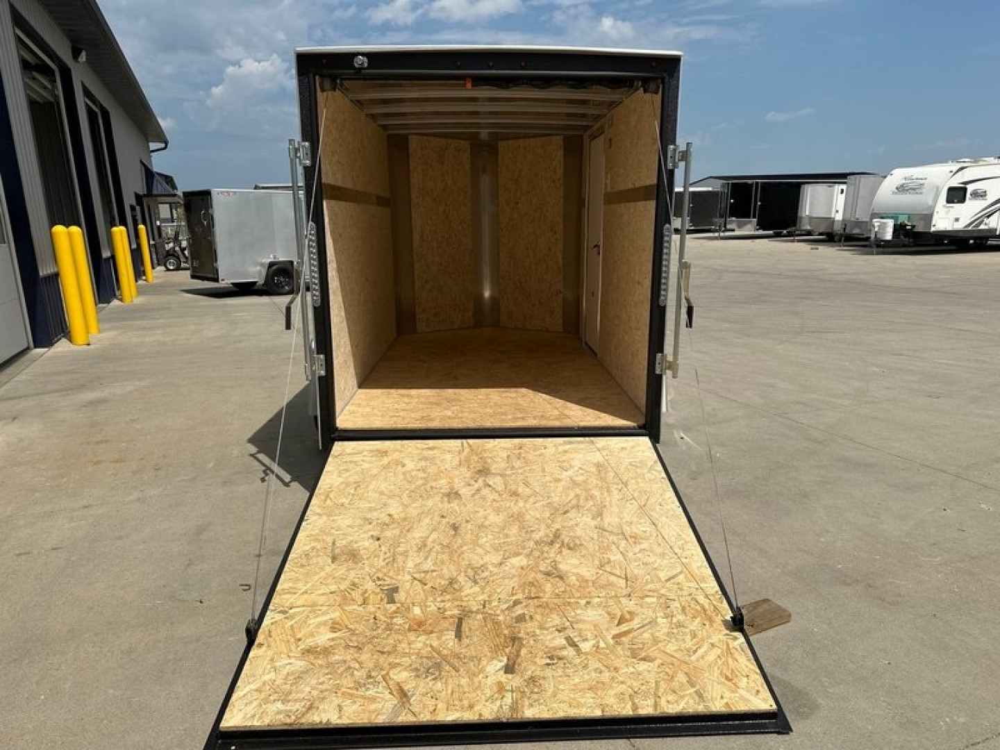 New 2025 H&H 6'x10' 3k Flat Top V-Nose Enclosed Cargo Trailer