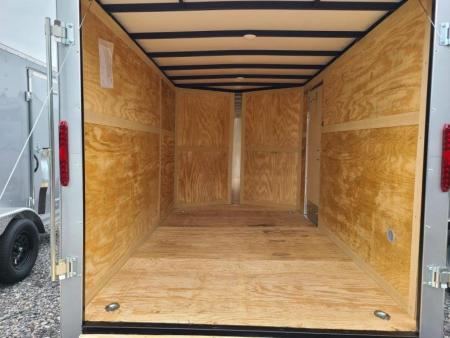 New 7 x 12 Homesteader Intrepid V-Nose Cargo Trailer, 3k GVWR **Silver PolyCor w/ 6" Extra Height & Ramp Door Pkg.