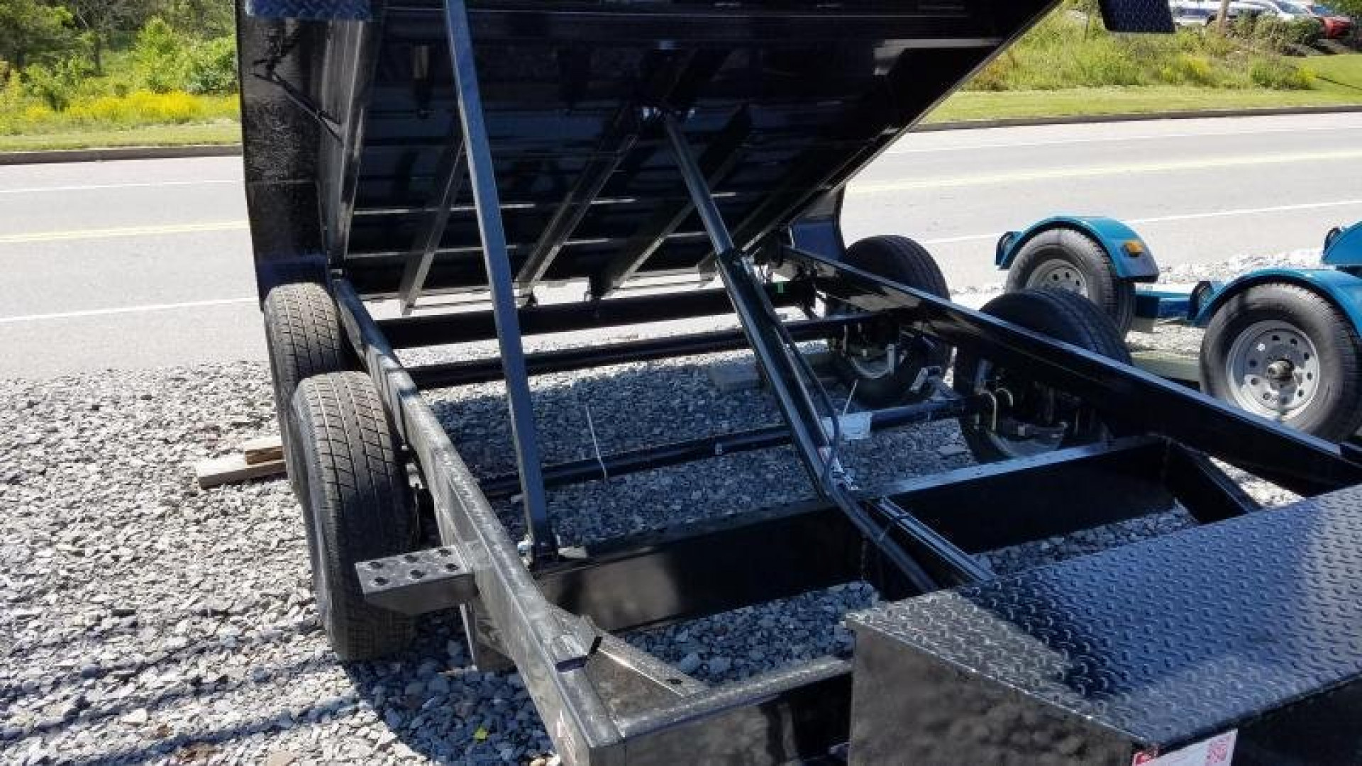 New 6 x 10 Sure Trac Low Profile Single Ram Dump, 7K GVWR ***Ramps Underneath, Dual Acting Tailgate, Power Up/Down Hyd.