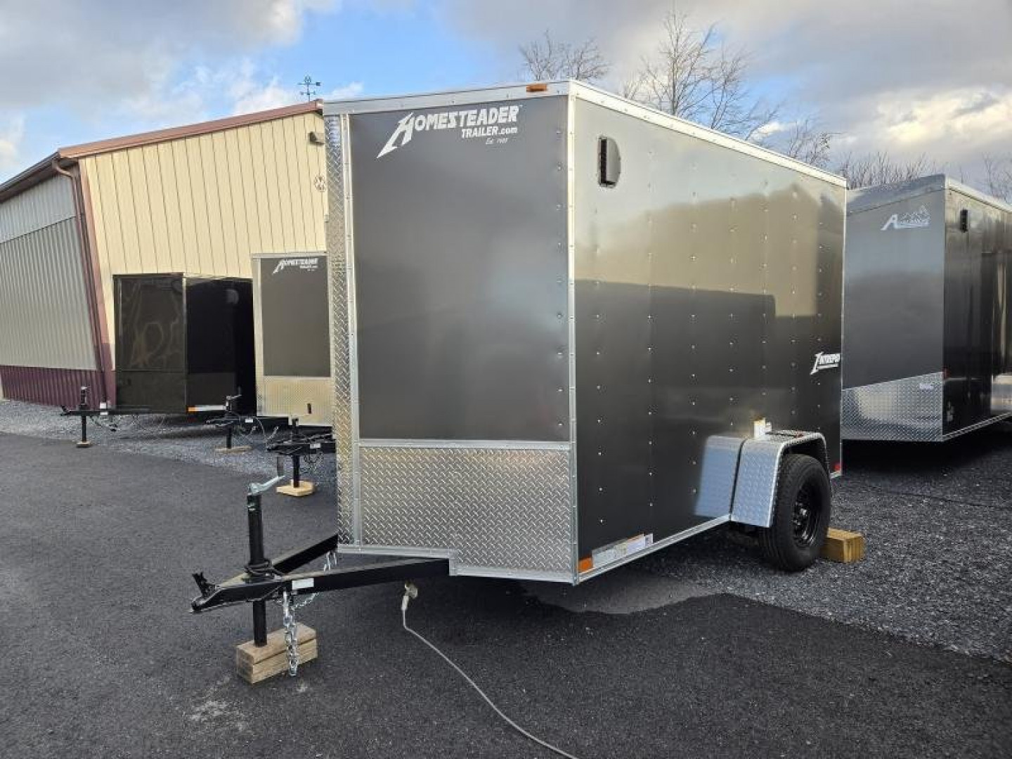 New 6 x 10 Homesteader Intrepid V-Nose Cargo Trailer, 3k GVWR **Charcoal w/ Ramp Door Package, 6" Extra Height, 16" OC Wall Posts
