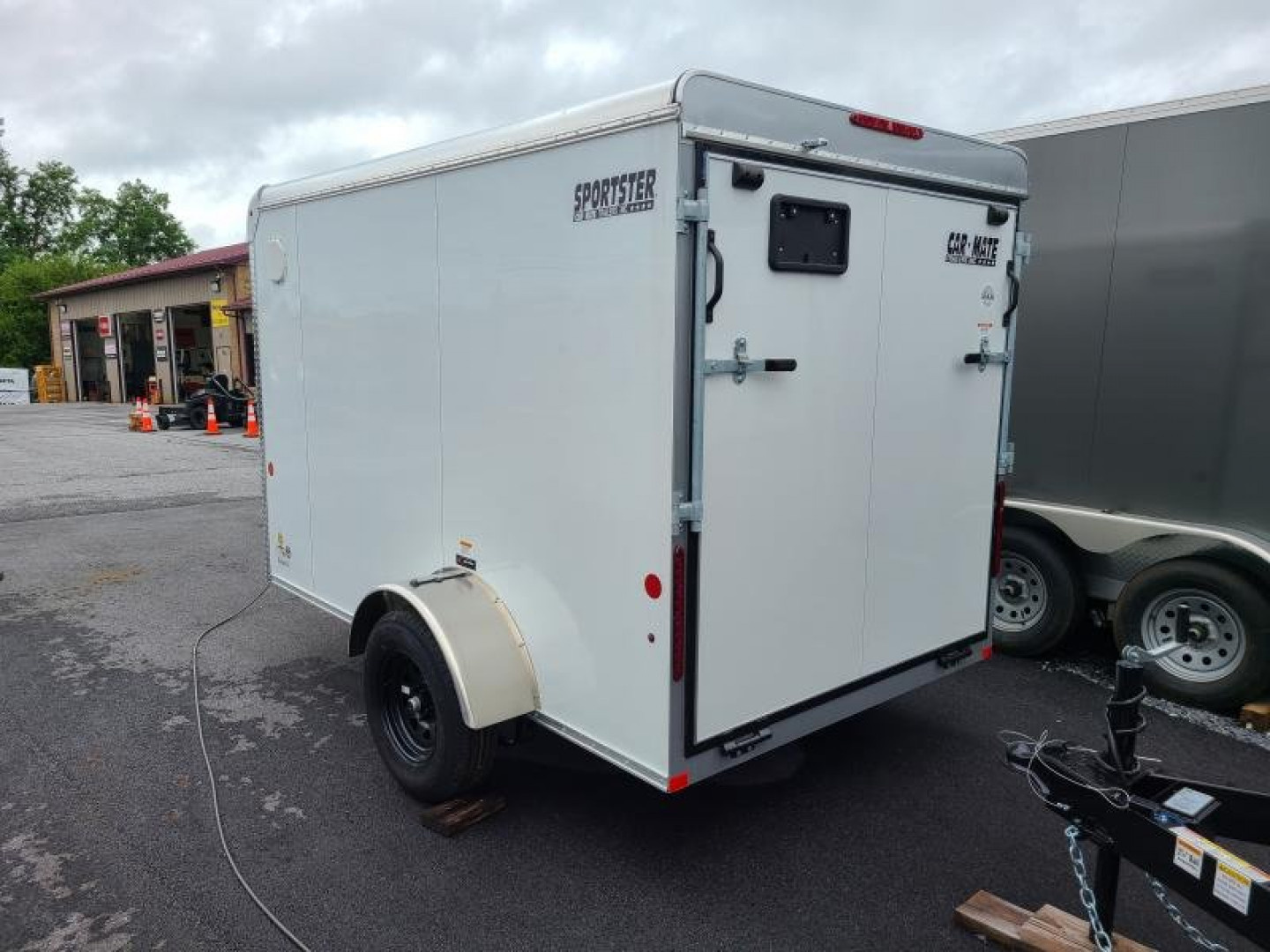 New 6 x 10 Car-Mate Sportster Enclosed Cargo Trailer 3K  ***White w/Ramp Door, 12v Int. Light, Wall Vents, Black Wheels