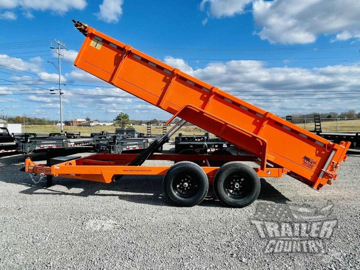 New 2026 New 7' x 16'  Hydraulic Dump Trailer w/ 24" High Sides, 1 Piece Floor, Remote, Power Up & Down, and MORE!