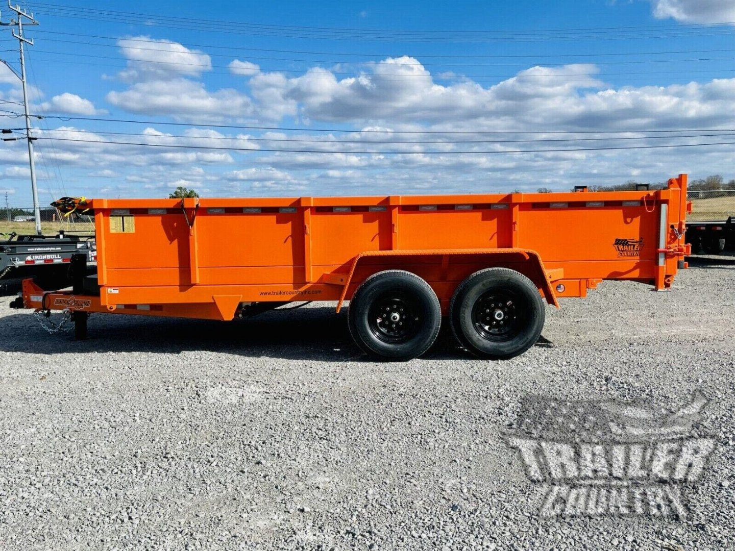 New 2026 New 7' x 16'  Hydraulic Dump Trailer w/ 24" High Sides, 1 Piece Floor, Remote, Power Up & Down, and MORE!