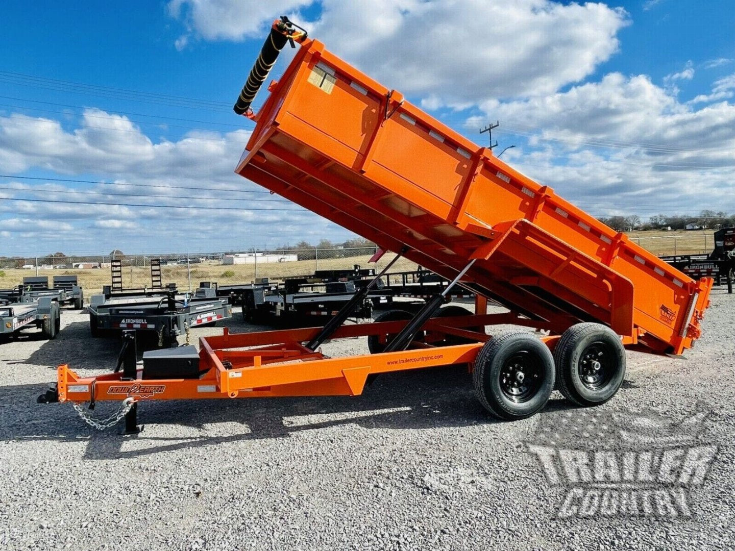New 2026 New 7' x 16'  Hydraulic Dump Trailer w/ 24" High Sides, 1 Piece Floor, Remote, Power Up & Down, and MORE!