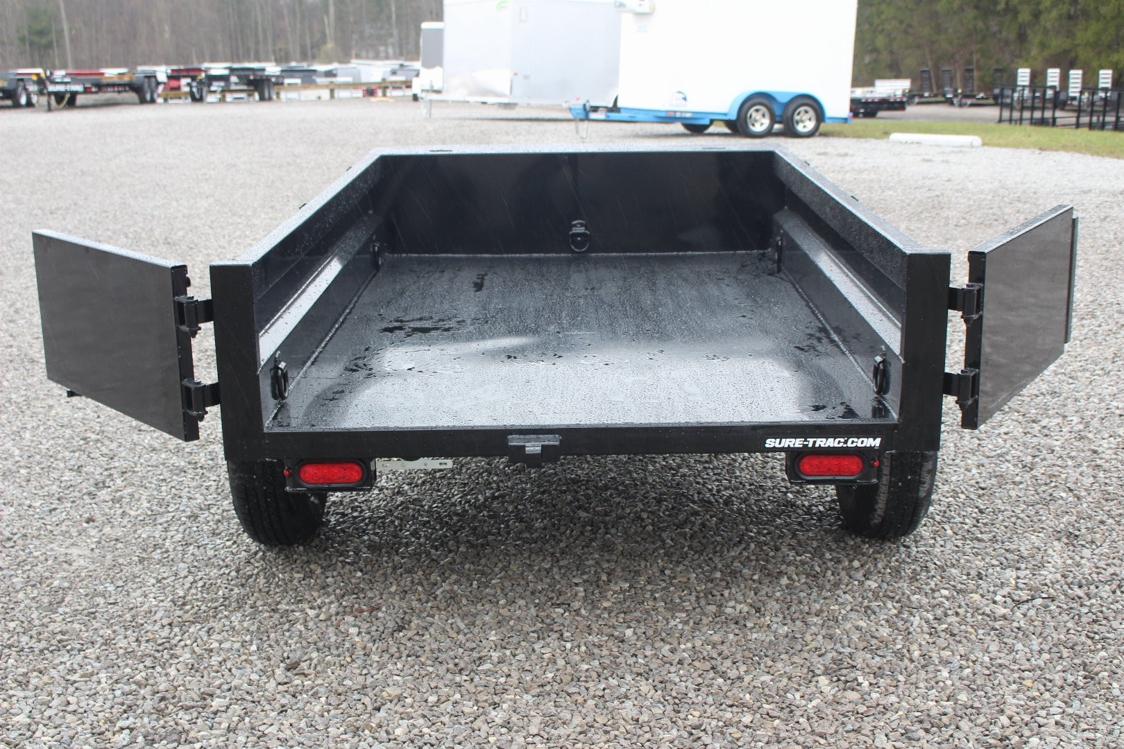 New 2025 Sure-Trac 5' x 8' Low Profile Homeowner Dump Trailer 5K - Single Ram (NO RAMPS) - BARN DOORS