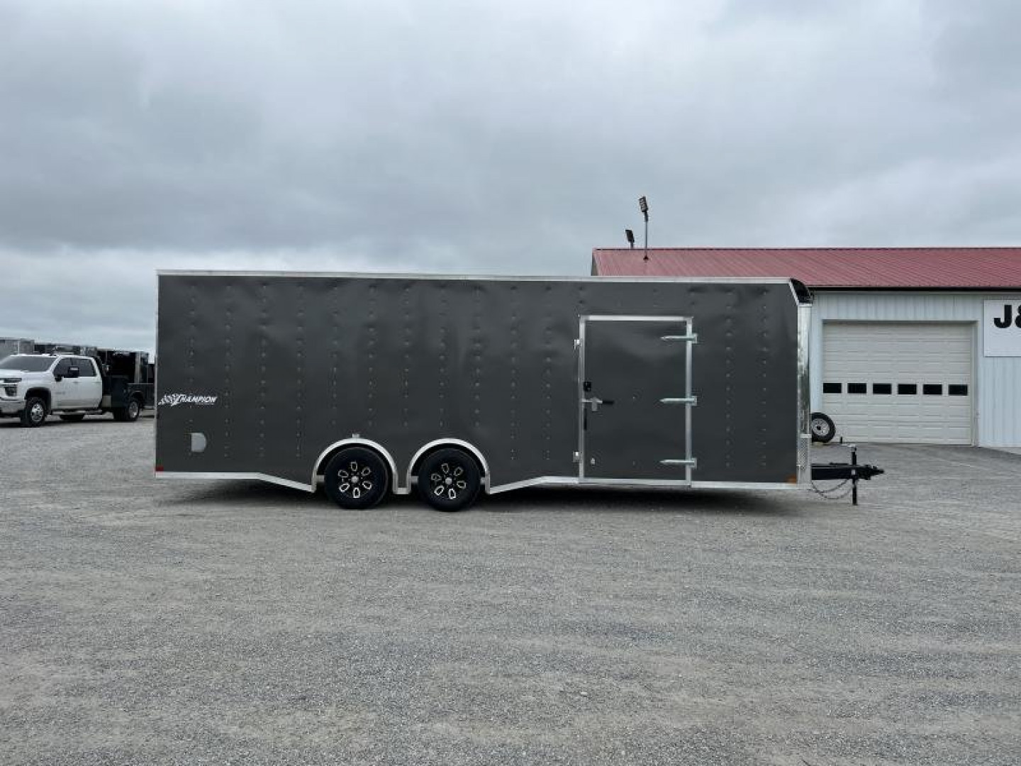 New 2025 Homesteader 8.5'x24' Champion Spread Axle Enclosed Race Trailer