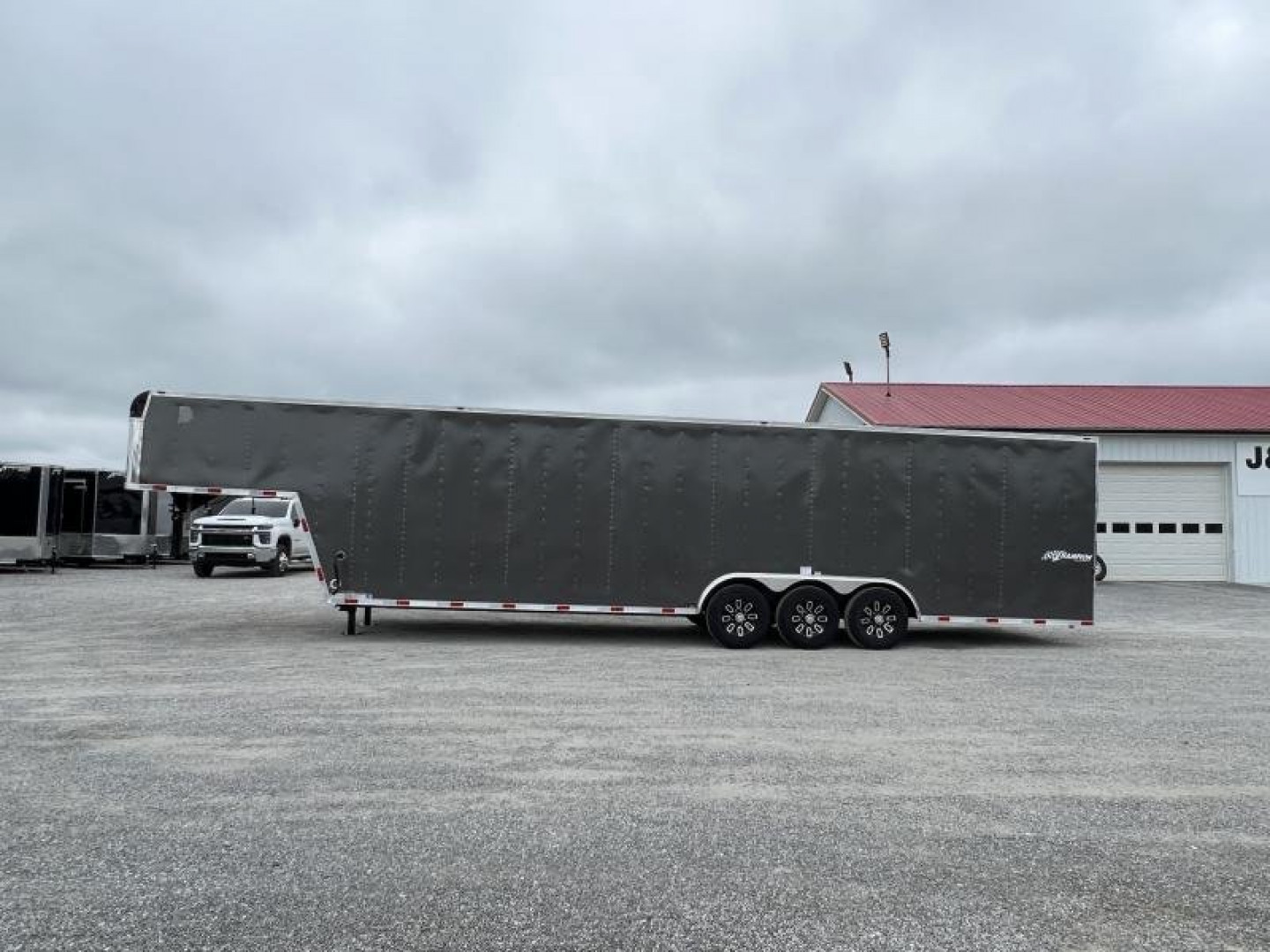 New 2024 Homesteader 8.5'x38' Champion Tri-Axle Gooseneck Enclosed Trailer