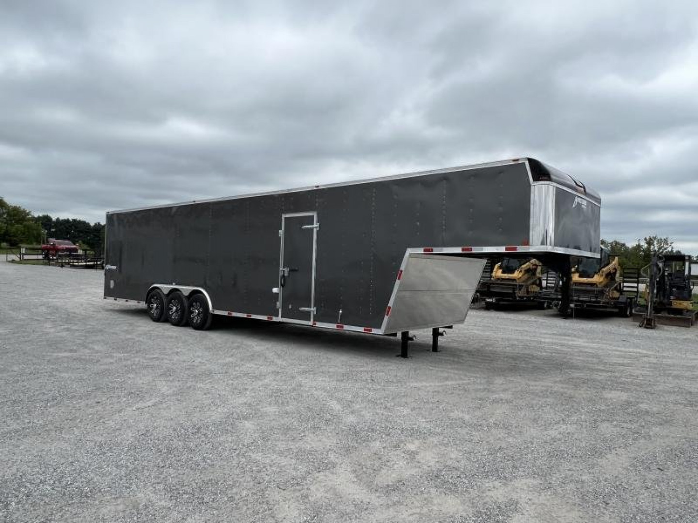 New 2024 Homesteader 8.5'x38' Champion Tri-Axle Gooseneck Enclosed Trailer