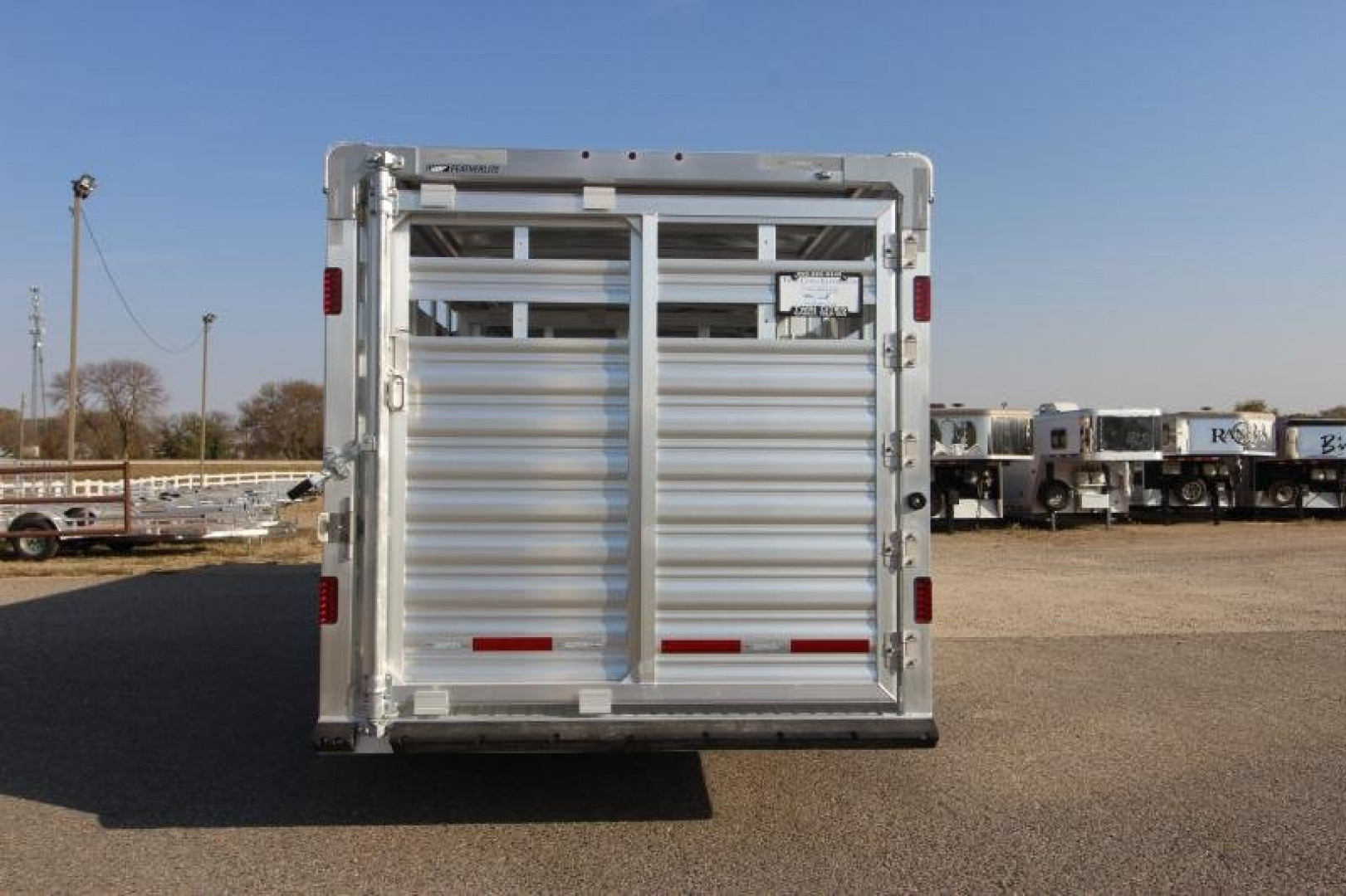 New 2025 Featherlite 8127 24' GN Stock / Stock Combo Trailer