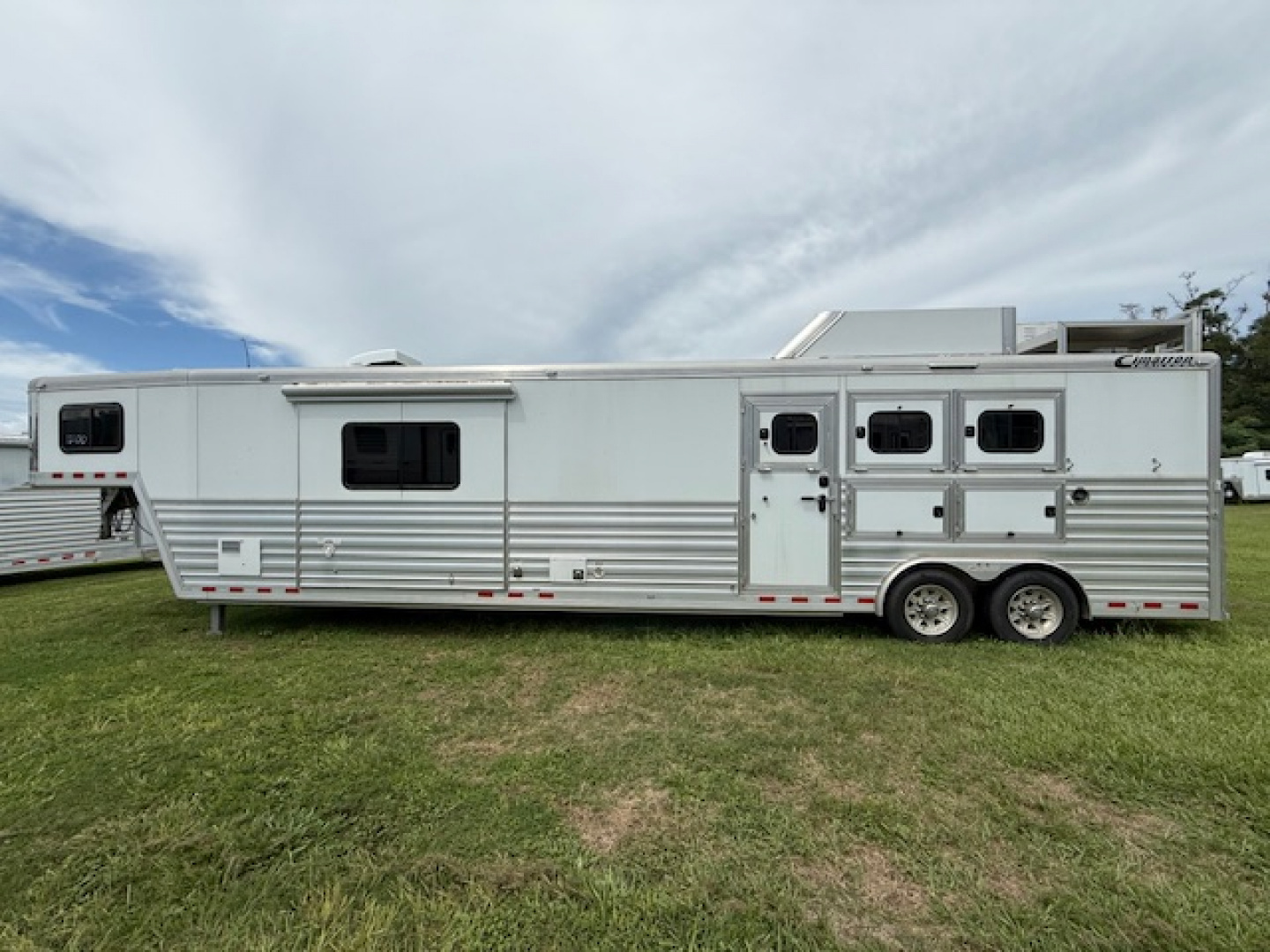 Used 2019 Cimarron Trailers 8' wide 3 horse w/15' lq gen and midtack Horse Trailer