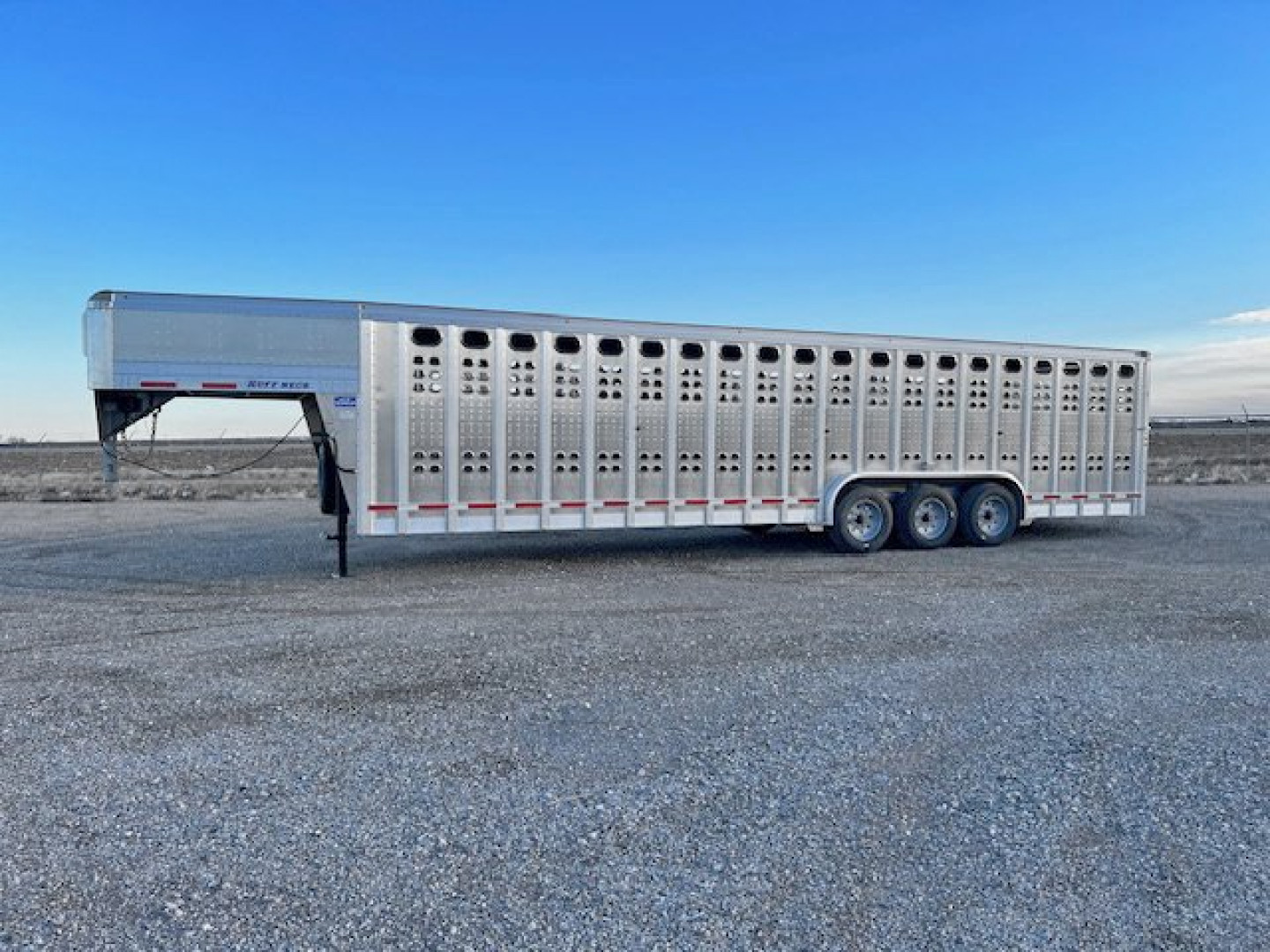 New 2025 32' EBY Ruff Neck Punch Side Stock Trailer