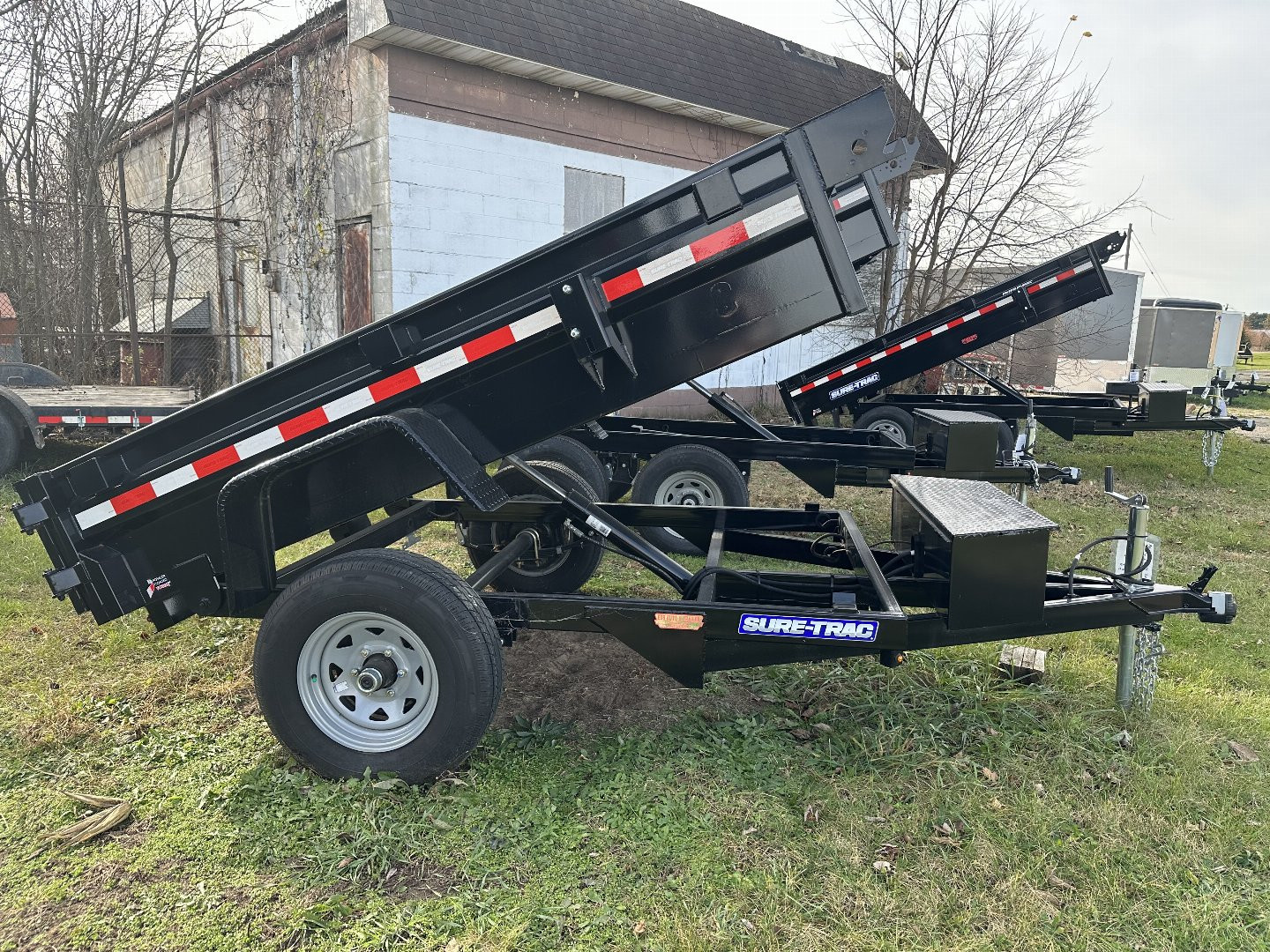 New 2023 Sure-Trac 5x8, 5k single ram, low pro Dump Trailer