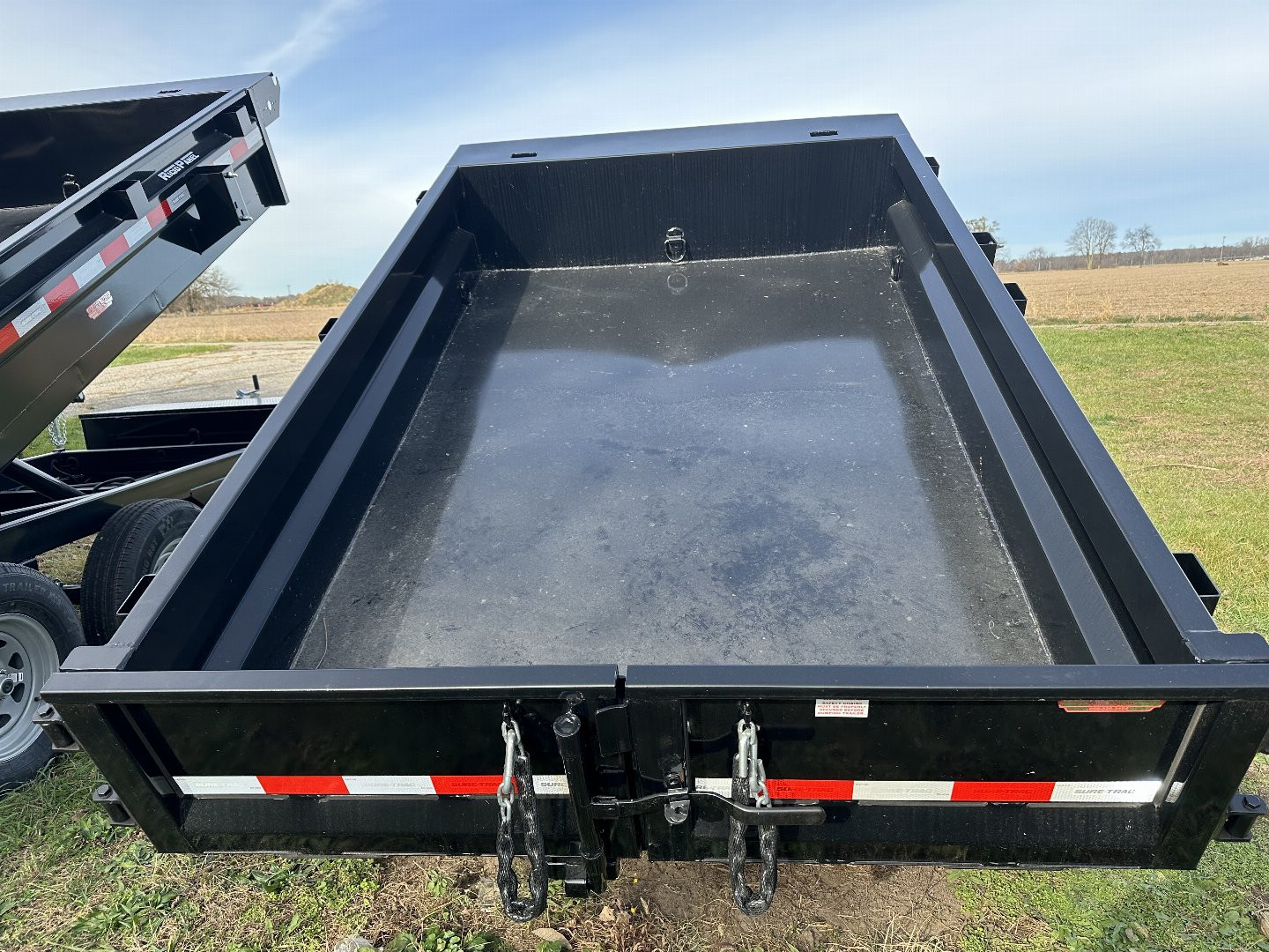 New 2023 Sure-Trac 5x8, 5k single ram, low pro Dump Trailer
