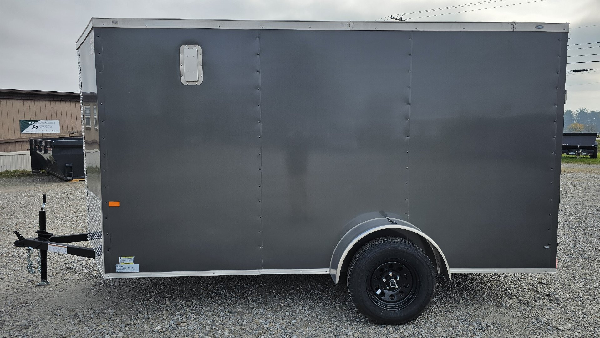 New 2025 ROCK SOLID CARGO 6'x12'x6'3" Cargo / Enclosed Trailer, Small dent on Rear