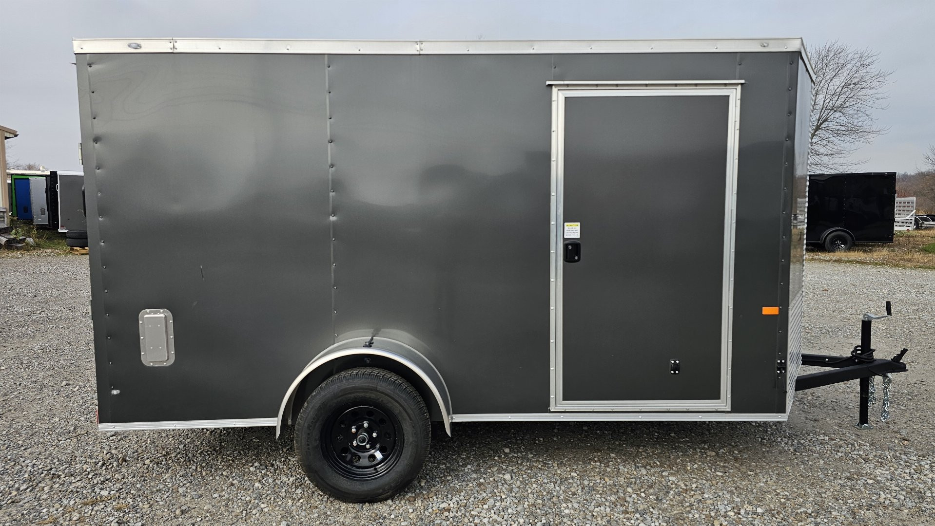 New 2025 ROCK SOLID CARGO 6'x12'x6'3" Cargo / Enclosed Trailer, Small dent on Rear