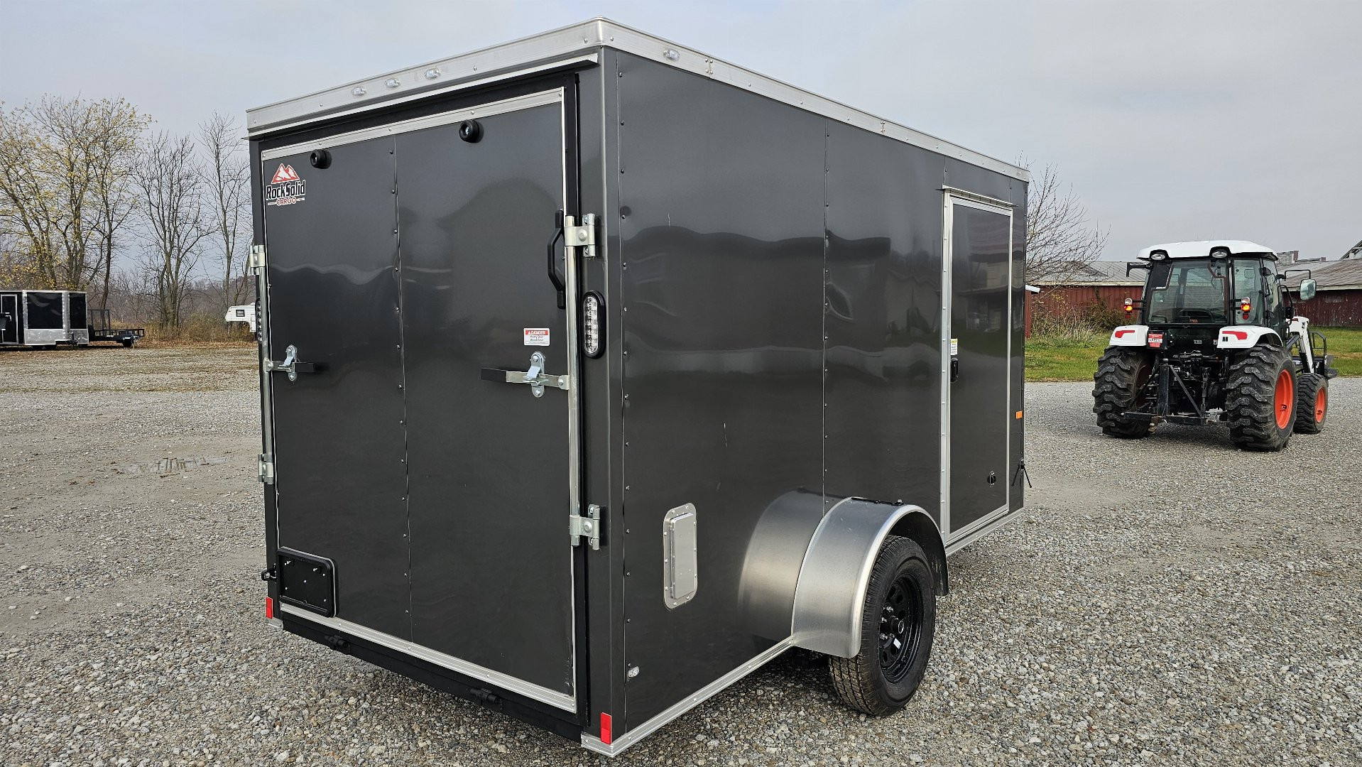 New 2025 ROCK SOLID CARGO 6'x12'x6'3" Cargo / Enclosed Trailer, Small dent on Rear