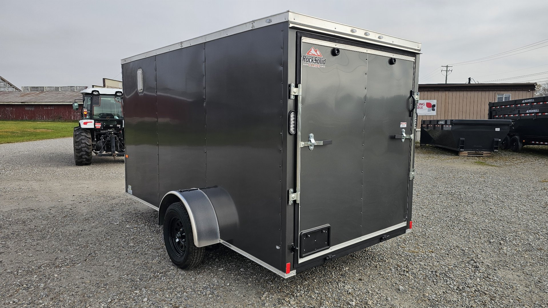New 2025 ROCK SOLID CARGO 6'x12'x6'3" Cargo / Enclosed Trailer, Small dent on Rear