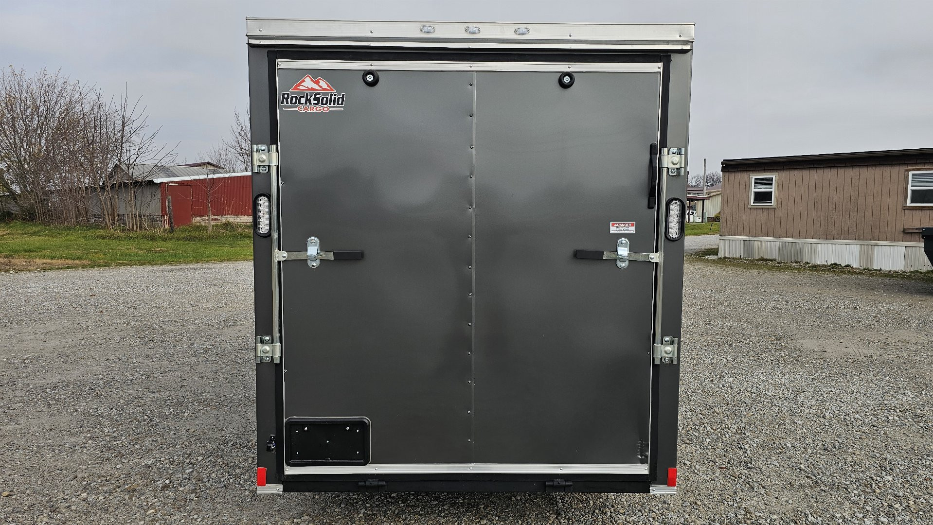 New 2025 ROCK SOLID CARGO 6'x12'x6'3" Cargo / Enclosed Trailer, Small dent on Rear