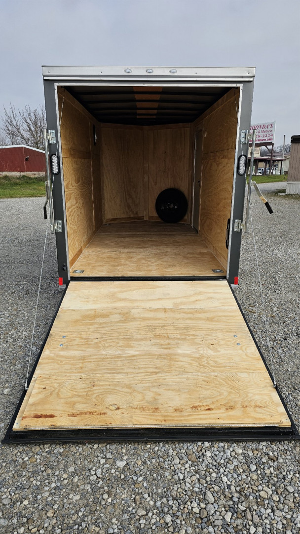 New 2025 ROCK SOLID CARGO 6'x12'x6'3" Cargo / Enclosed Trailer, Small dent on Rear