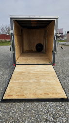 New 2025 ROCK SOLID CARGO 6'x12'x6'3" Cargo / Enclosed Trailer, Small dent on Rear