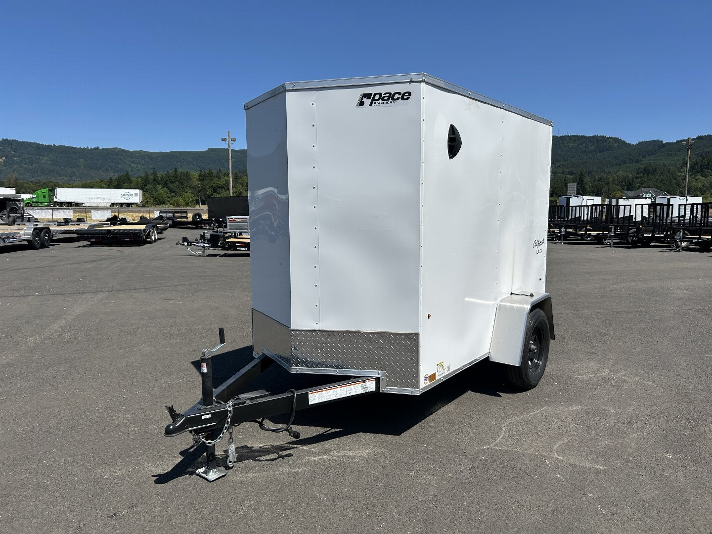 New 2025 Pace American 5X8 Outback DLX Flat Top Enclosed Trailer with Rear Ramp Door & Electric Brakes 3.5K GVWR