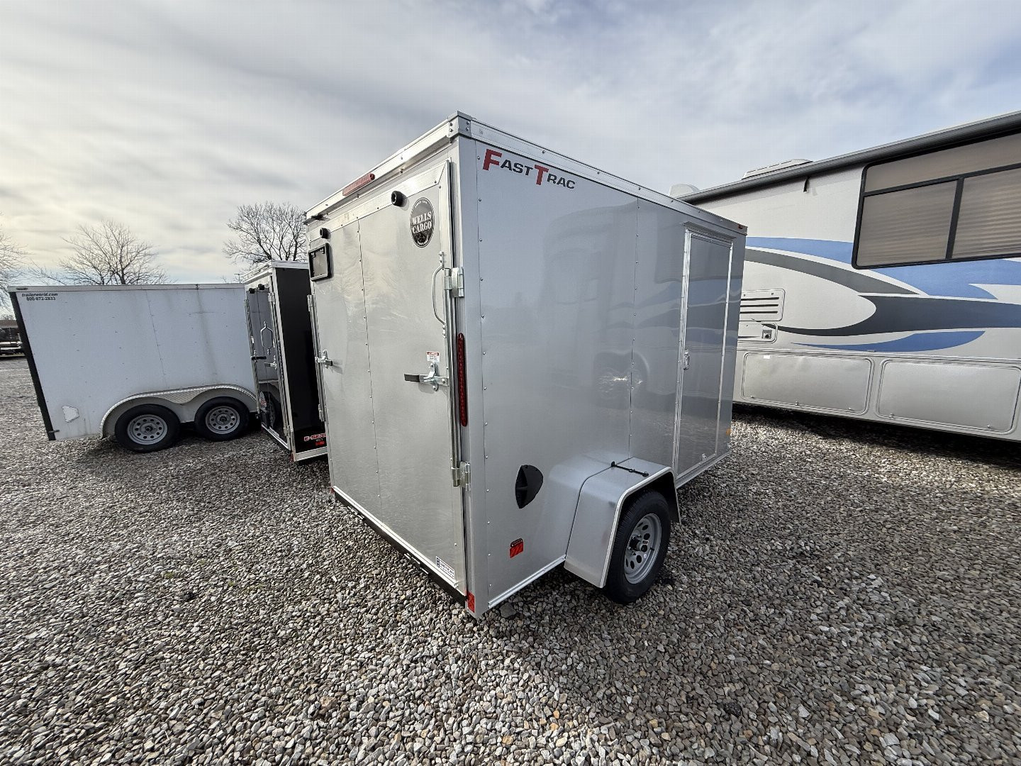 New 2025 WELLS CARGO FT610S2-D Cargo / Enclosed Trailer 6X10 SA RAMP DOOR (GVW:2990) SILVER FROST