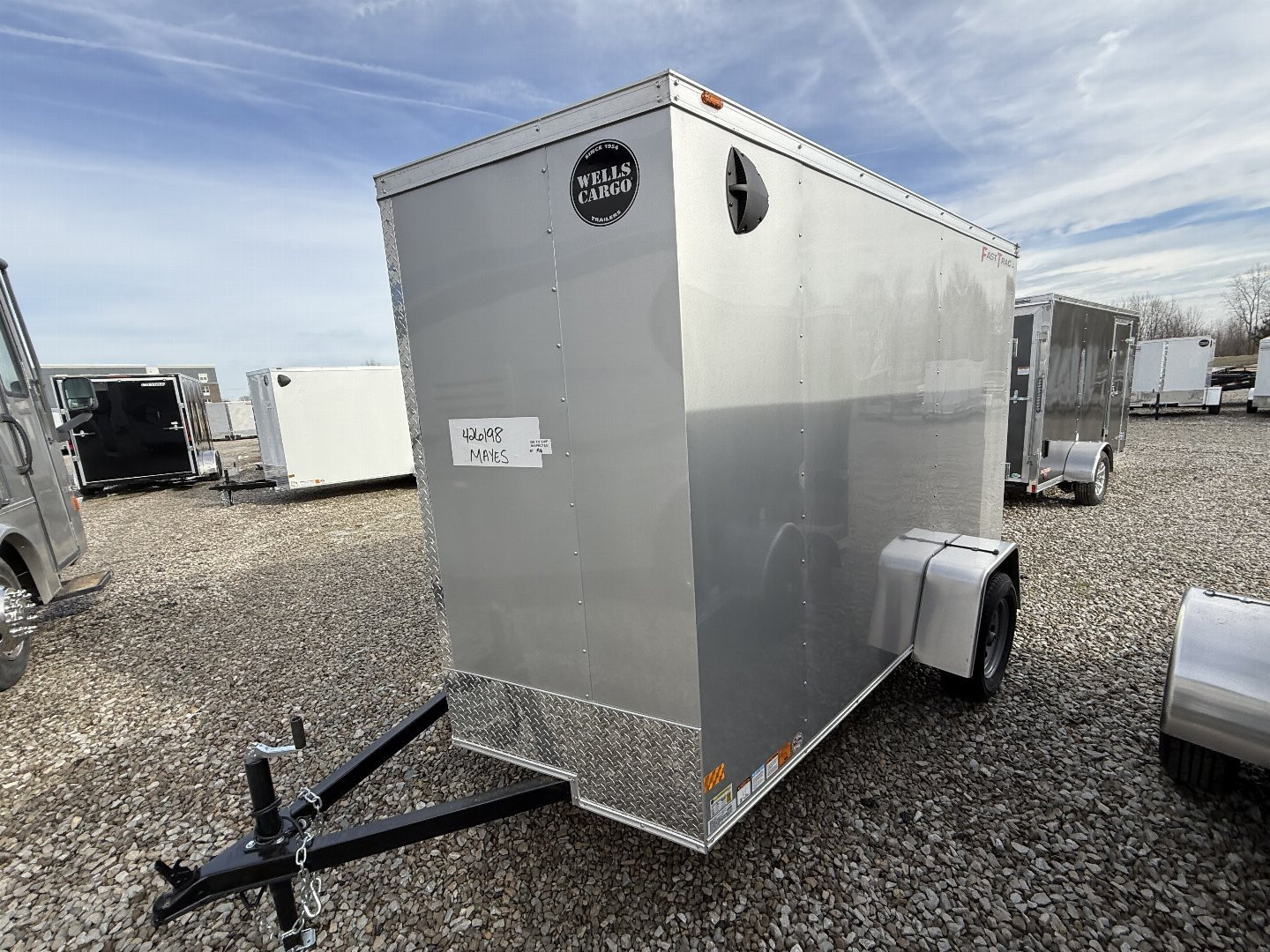 New 2025 WELLS CARGO FT610S2-D Cargo / Enclosed Trailer 6X10 SA RAMP DOOR (GVW:2990) SILVER FROST