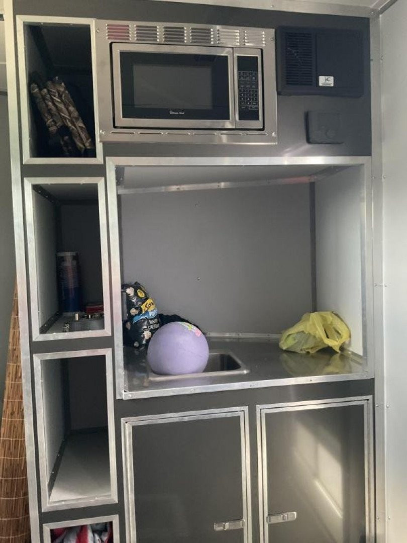 New 2022 Cargo Mate EHW718TA2 Enclosed Cargo<br />
Factory Demo<br />
No miles other than shipping<br />
7x18 TA RAMP DOOR (GVW:7000)<br />
Camper Model<br />
Pop Out Camper side mounted bed <br />
110 Power<br />
Toilet and Sink <br />
Wet Sounds Stereo