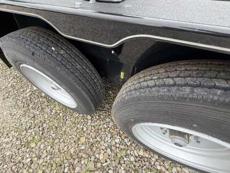 Used "NEVER USED" <br />
Plus it has the extra bucket rack welded to front raised up<br />
<br />
2023 Behnke CBCT1816E-S Equipment Trailer 83X18 TA WOOD FILLED RAMPS (GVW:12000)