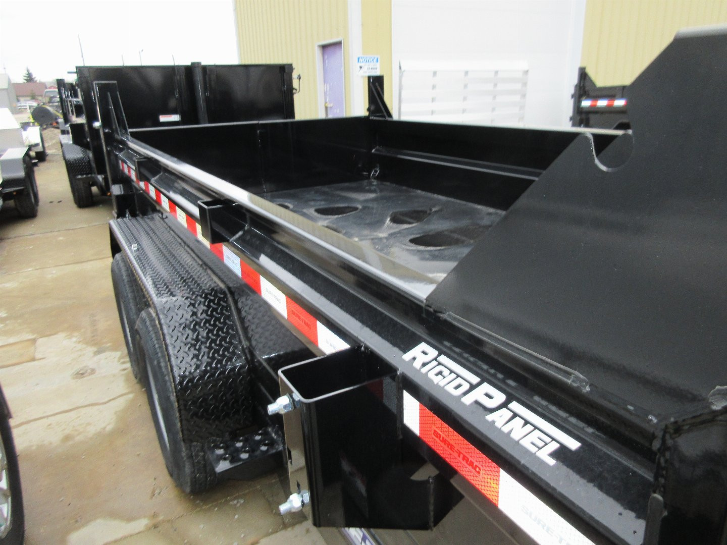 New 2025 Sure-Trac 6 x 12 Low Profile Dump Trailer 10K Single Ram