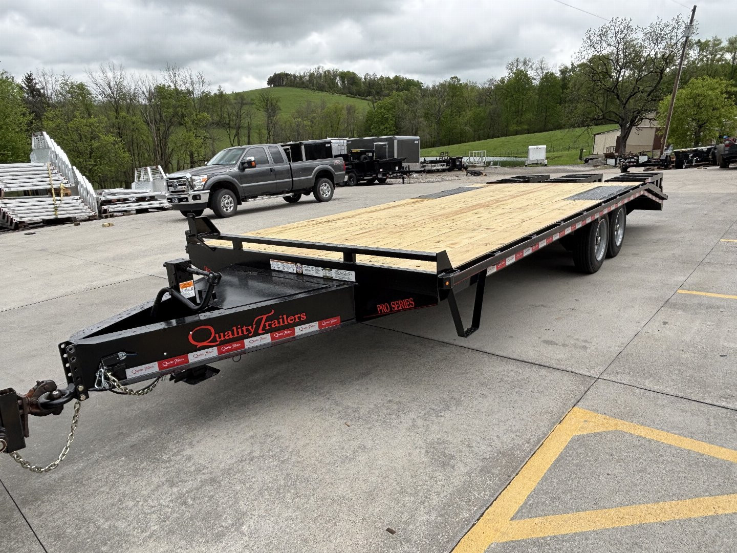 New 2025 Quality Trailers 23' Deckover (18' + 5' Dovetail) - Pro Series w/ 3 Lay Down Ramps - 17000# GVWR