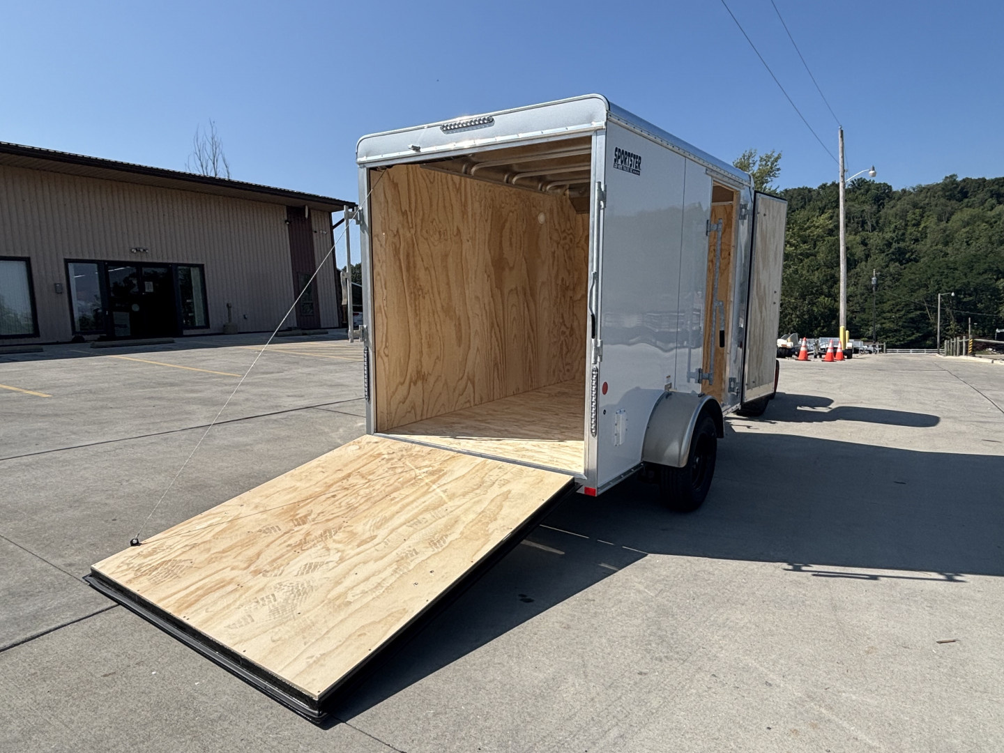 New 2025 Car Mate Trailers 6x10 Sportster Enclosed Trailer - Crystal White w/ Ramp - 2990# GVWR