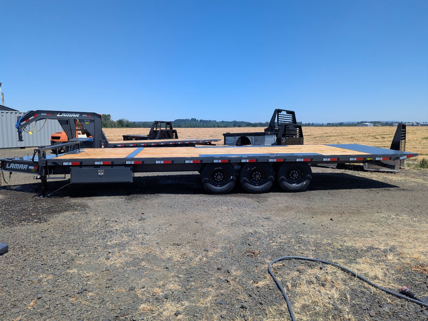 New 2026 Lamar Trailers 102X26/21K Tilt Trailer