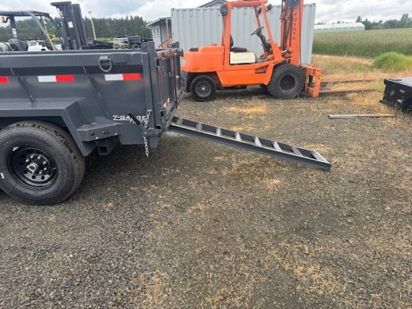 New 2025 Lamar Trailers 83" x 12' - 14K Dump Trailer 24" SIDES