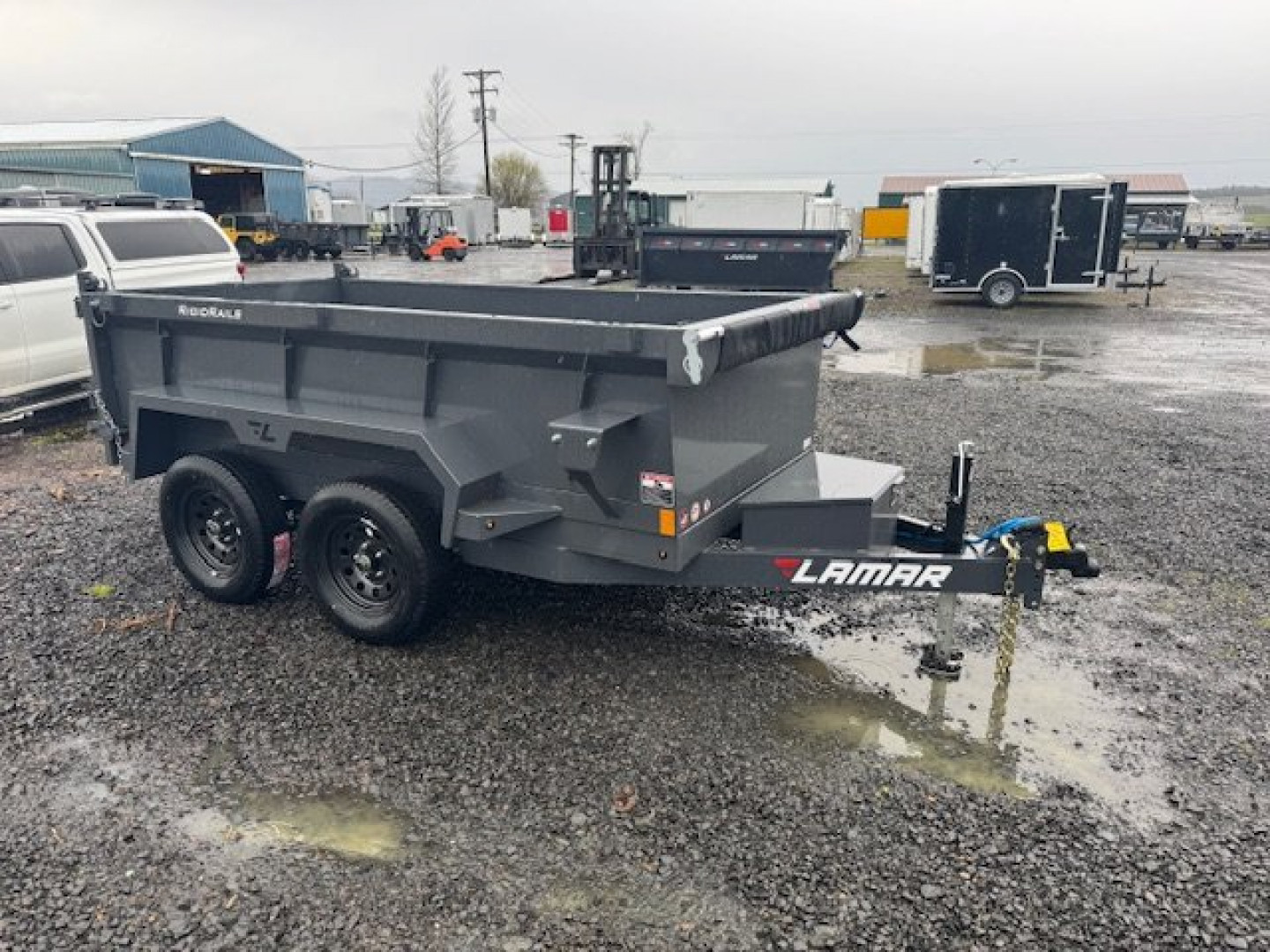 New 2025 Lamar Trailers Single Axle - 60" x 10' -7K Dump Trailer 24" SIDES