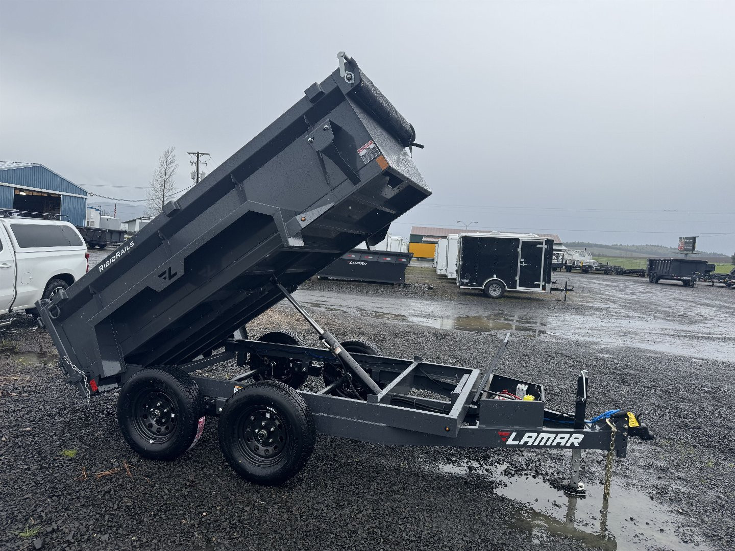 New 2025 Lamar Trailers Single Axle - 60" x 10' -7K Dump Trailer 24" SIDES