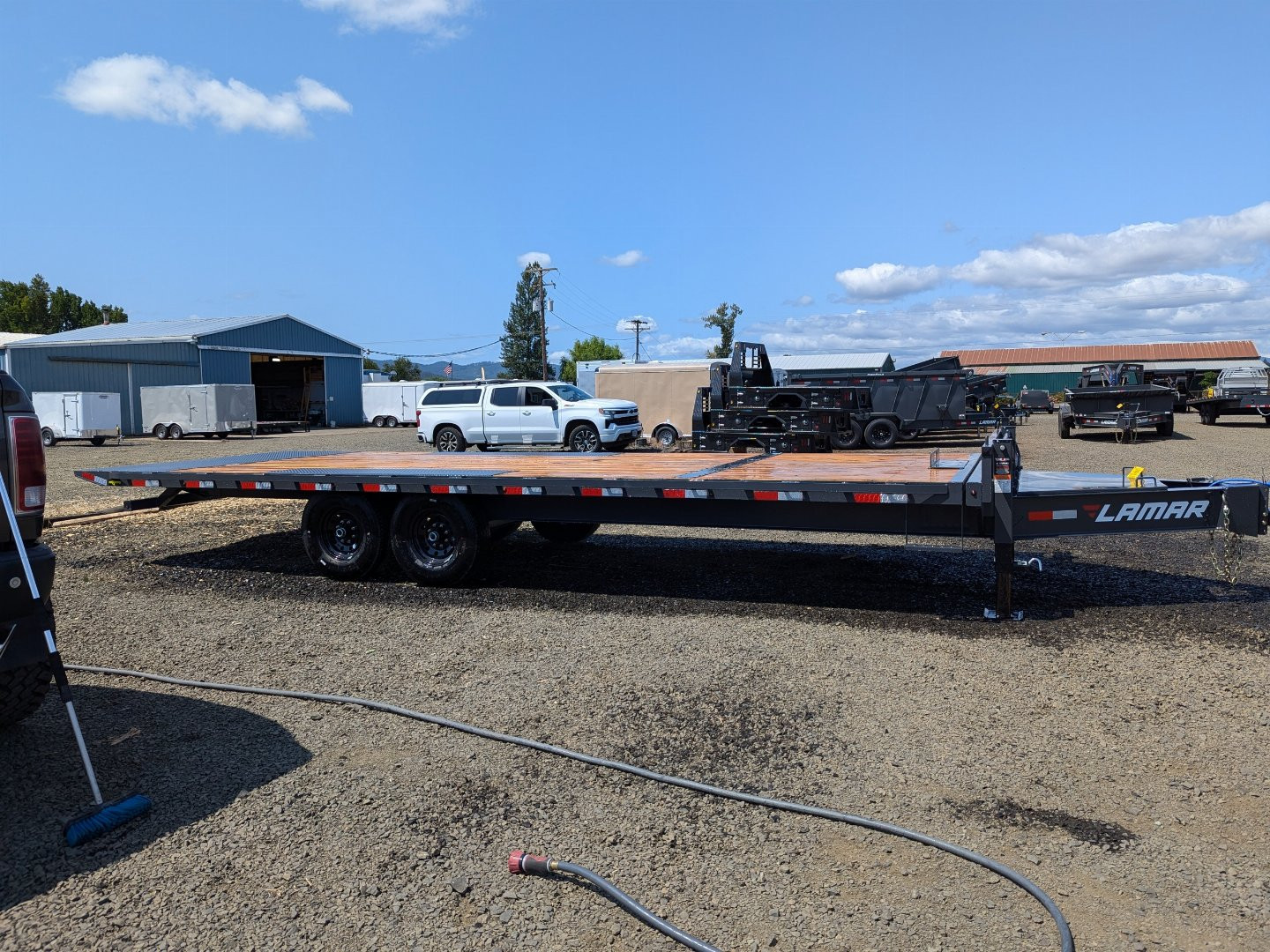 New 2025 LAMAR TRAILERS FA 102x24 14K Tilt Trailer