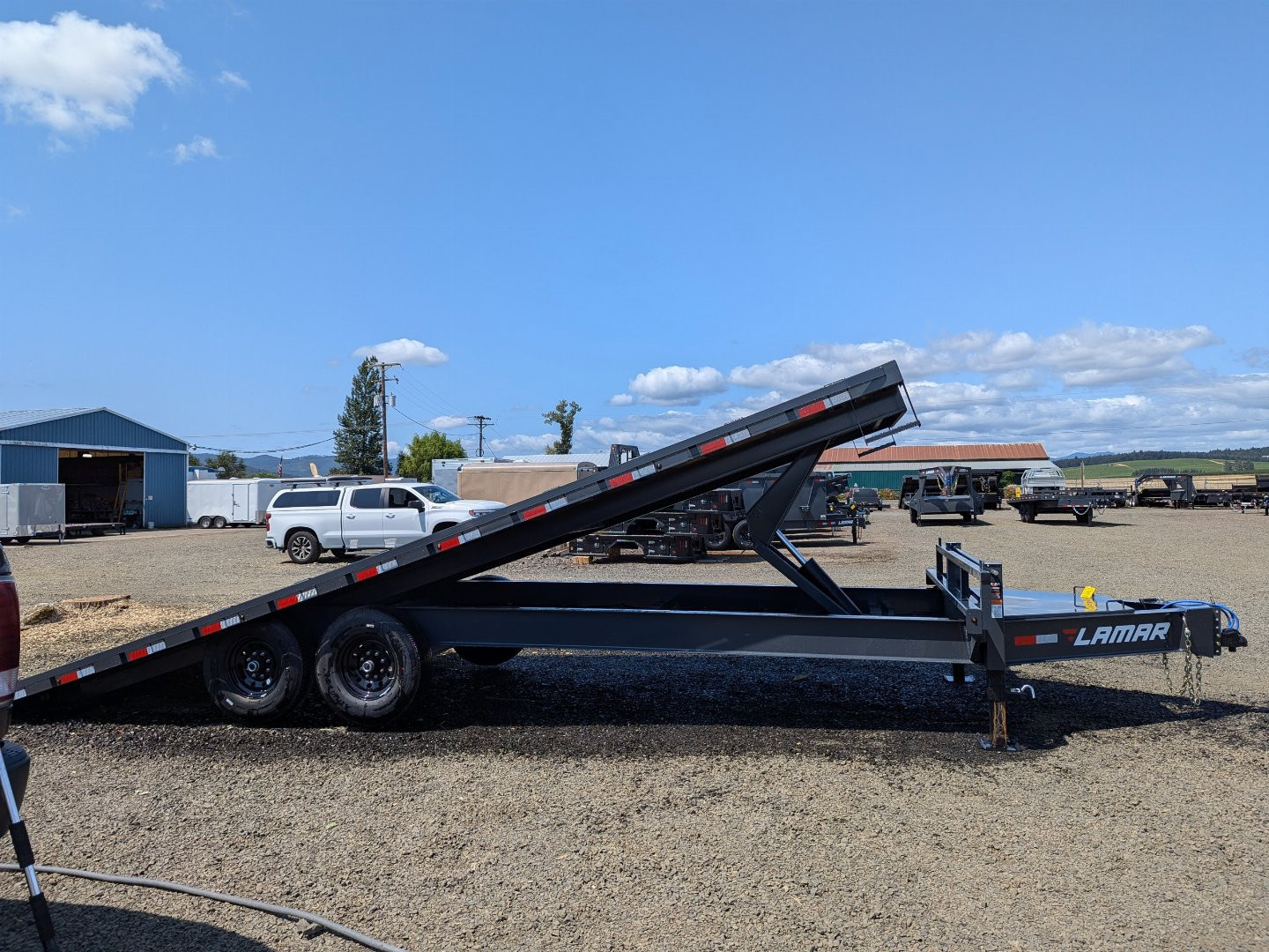 New 2025 LAMAR TRAILERS FA 102x24 14K Tilt Trailer