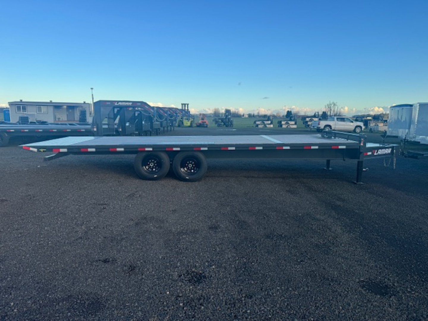 New 2025 LAMAR TRAILERS FA 102" x 24' 14K Tilt Trailer