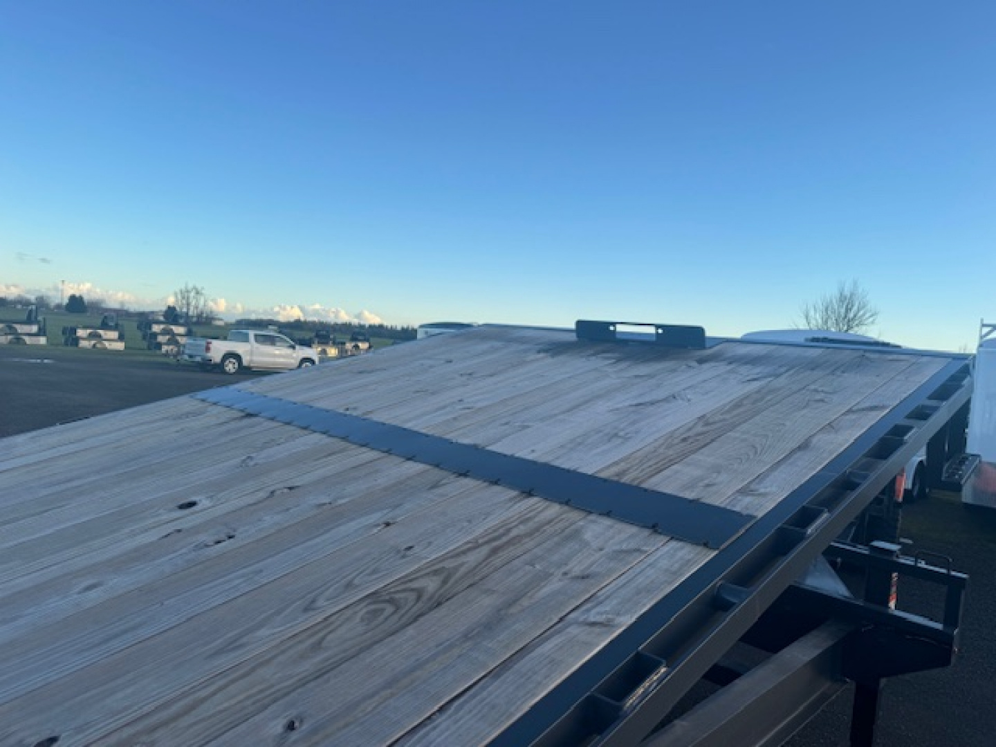 New 2025 LAMAR TRAILERS FA 102" x 24' 14K Tilt Trailer