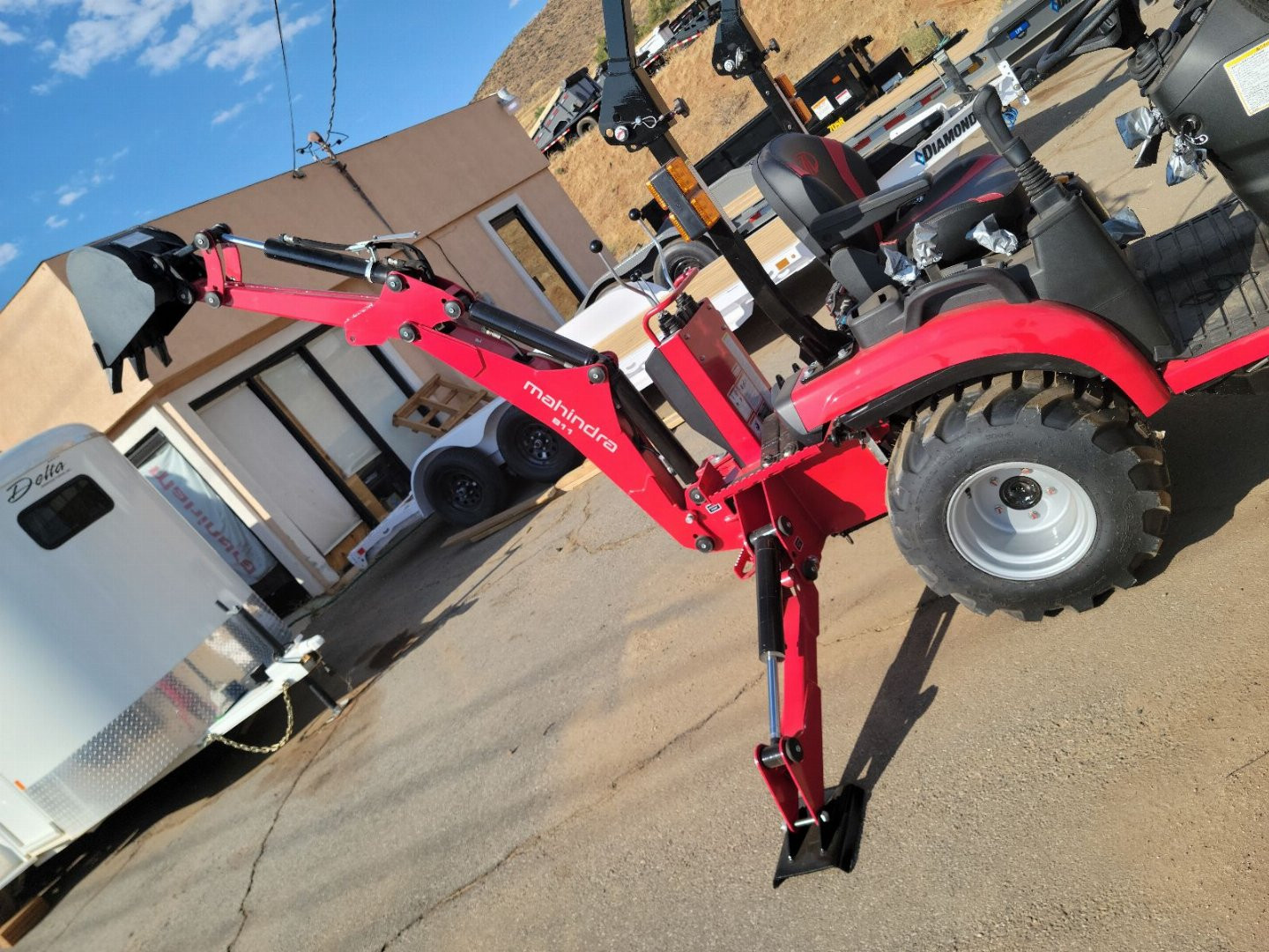 New 2024 Mahindra 1120 HST Loader and backhoe