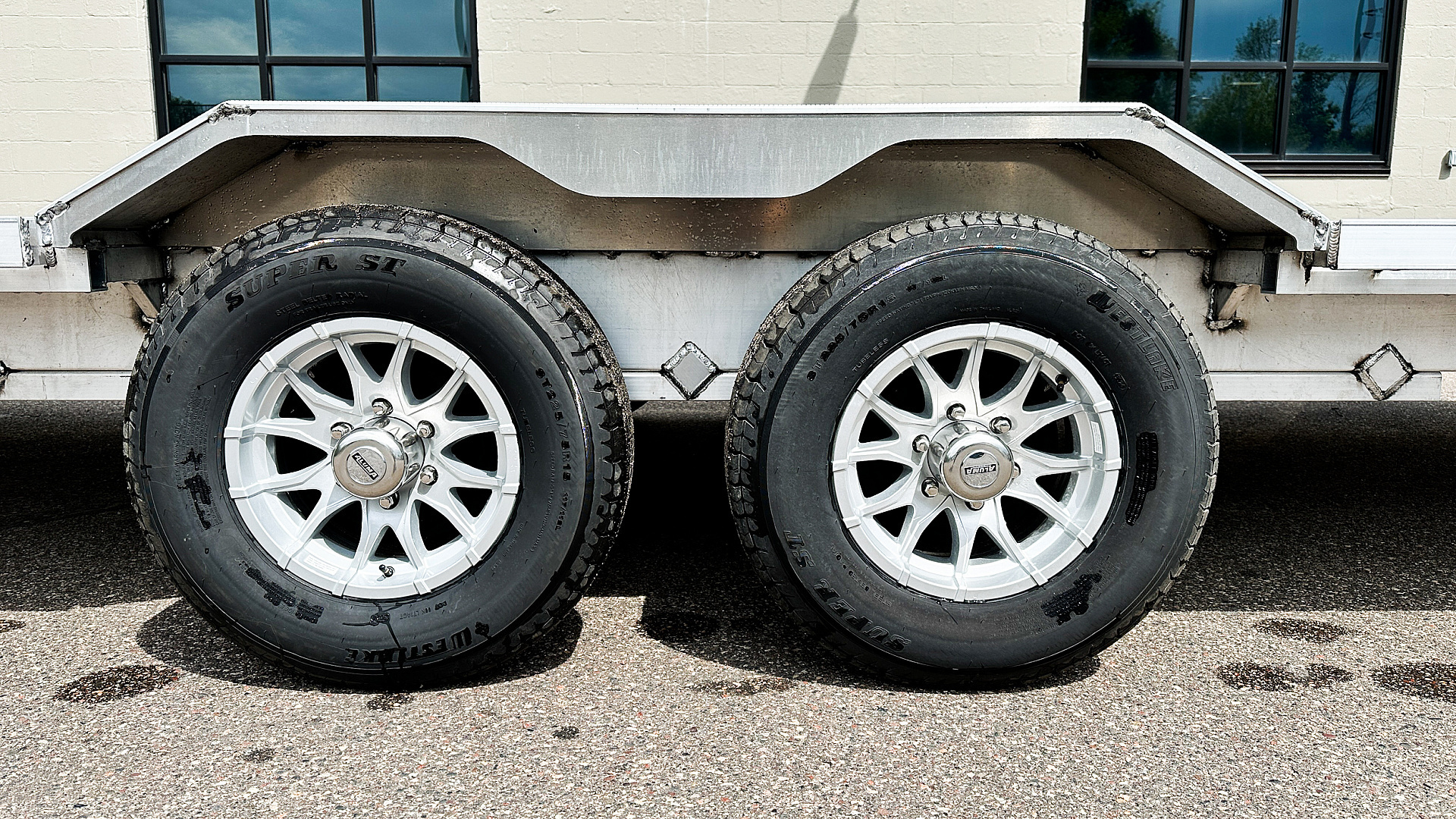 New Aluma Wide Body 10x28 Tandem Axle Equipment Hauler!