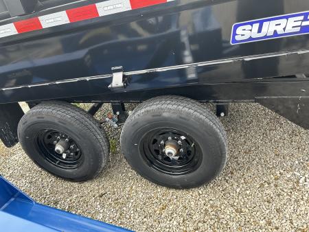 New 2025 Sure-Trac 6' x 10' 10K Single Ram SD Deckover Dump Trailer