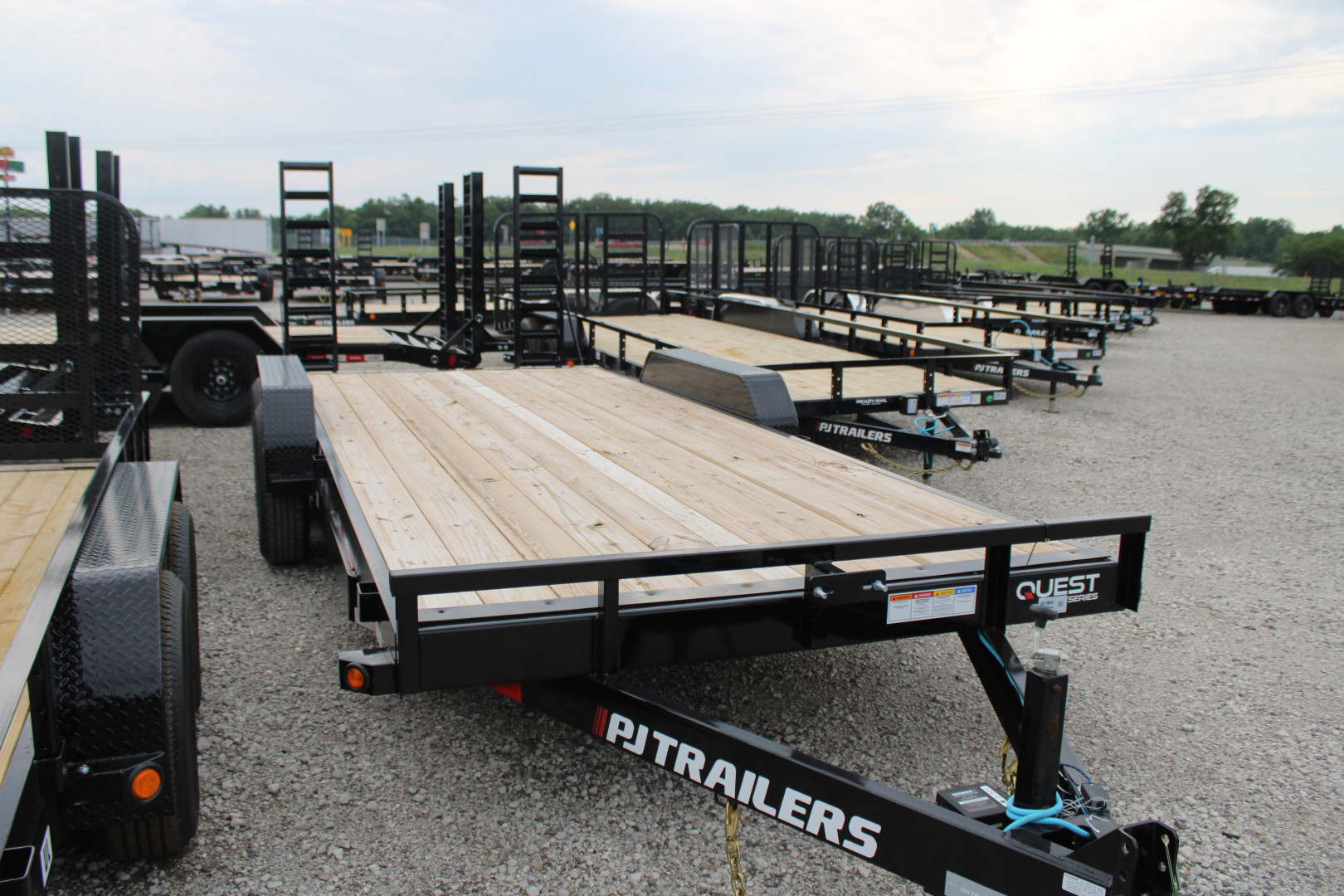 New 2026 PJ Trailers 20' FR 14K GVWR EQUIPMENT TRAILER WITH FOLDING RAMPS 49525 Equipment Trailer